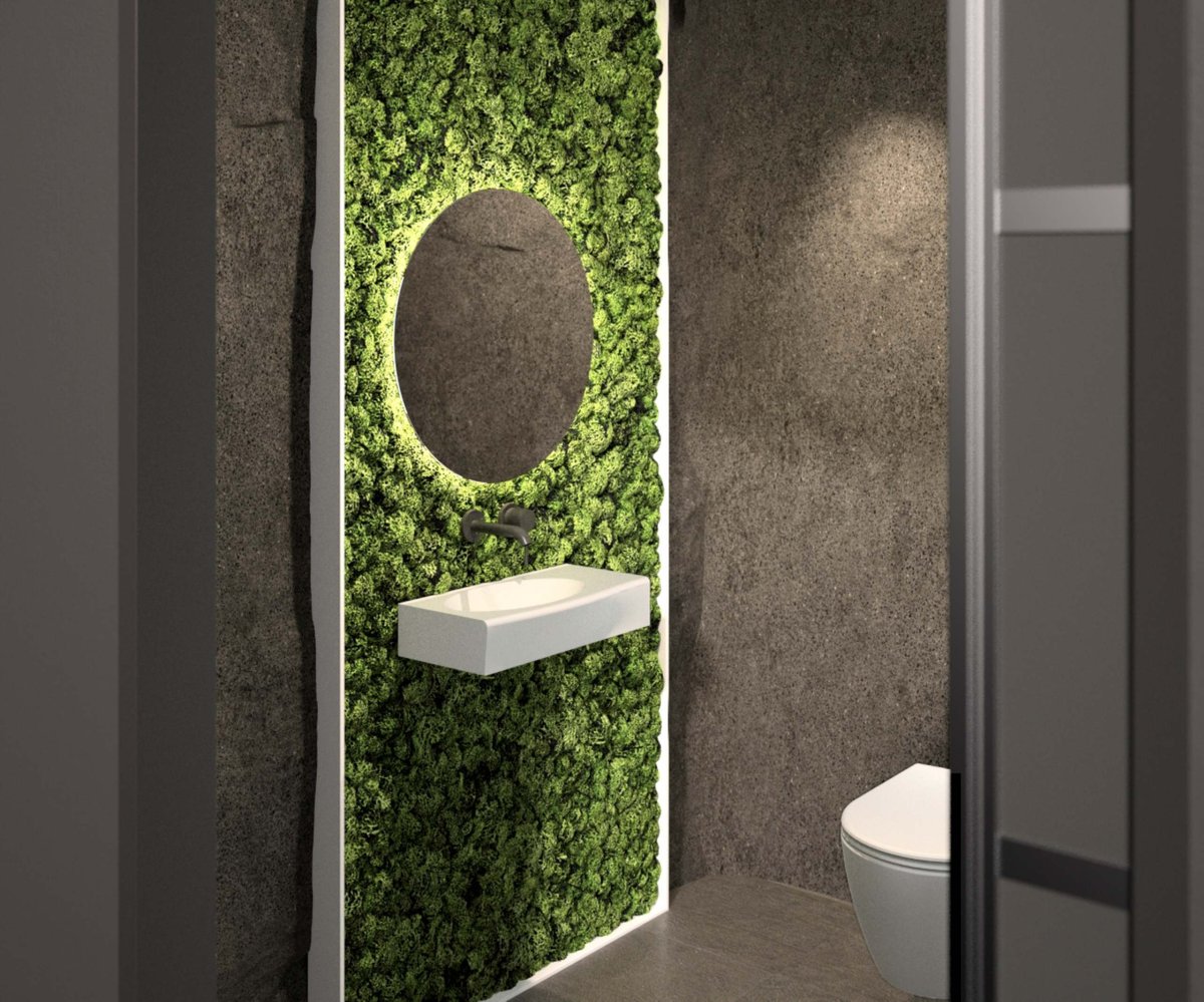 Runder-Badezimmerspiegel-mit-Waschbecken-an-bepflanzter-grüner-Wand